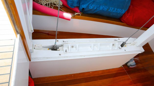 The white rudder in Dianna, a Yachting World Diamond, mostly surrounded by wooden decking.