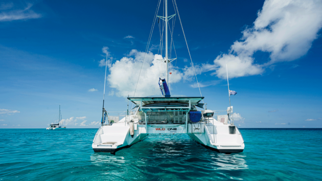 Boat in turquoise sea with sun shine on it